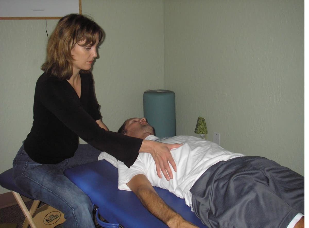 Gentle hands-on NeuroMovement session with a child